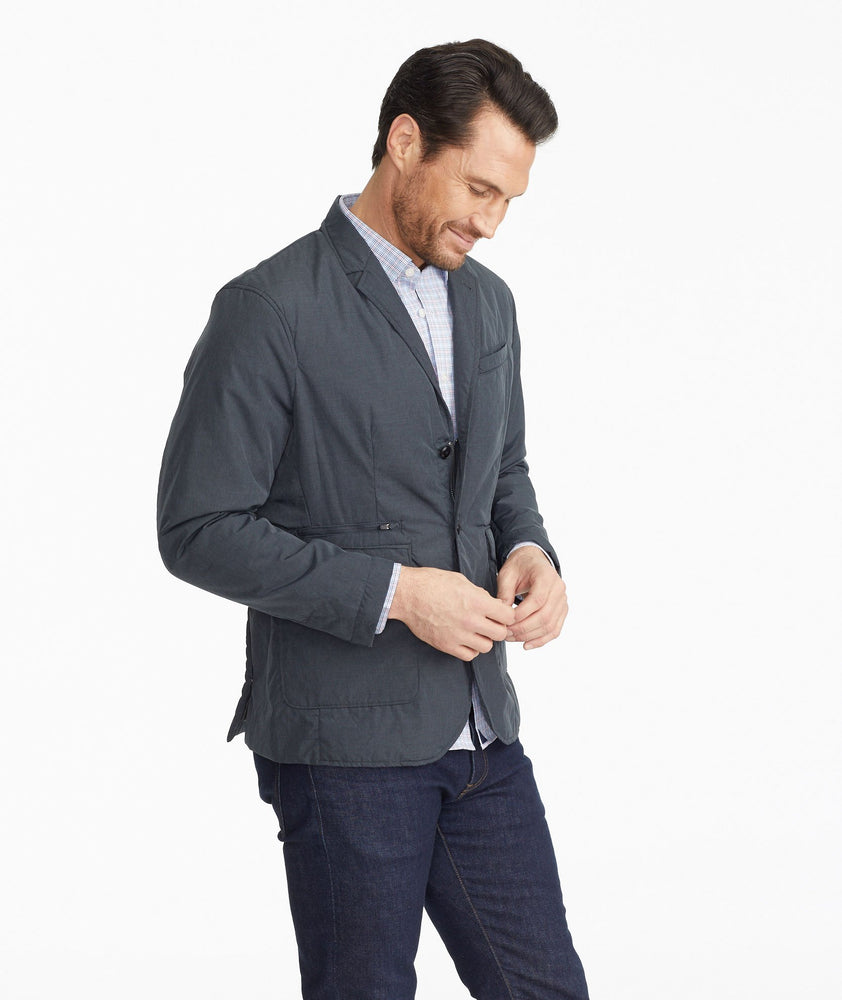 Model wearing a Grey The Travel Blazer