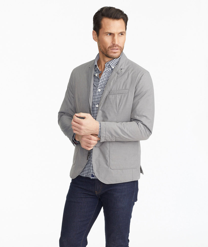 Model wearing a Light Grey The Travel Blazer
