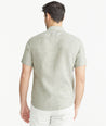 Model is wearing UNTUCKit Olive Wrinkle-Resistant Linen Short-Sleeve Cameron Shirt.