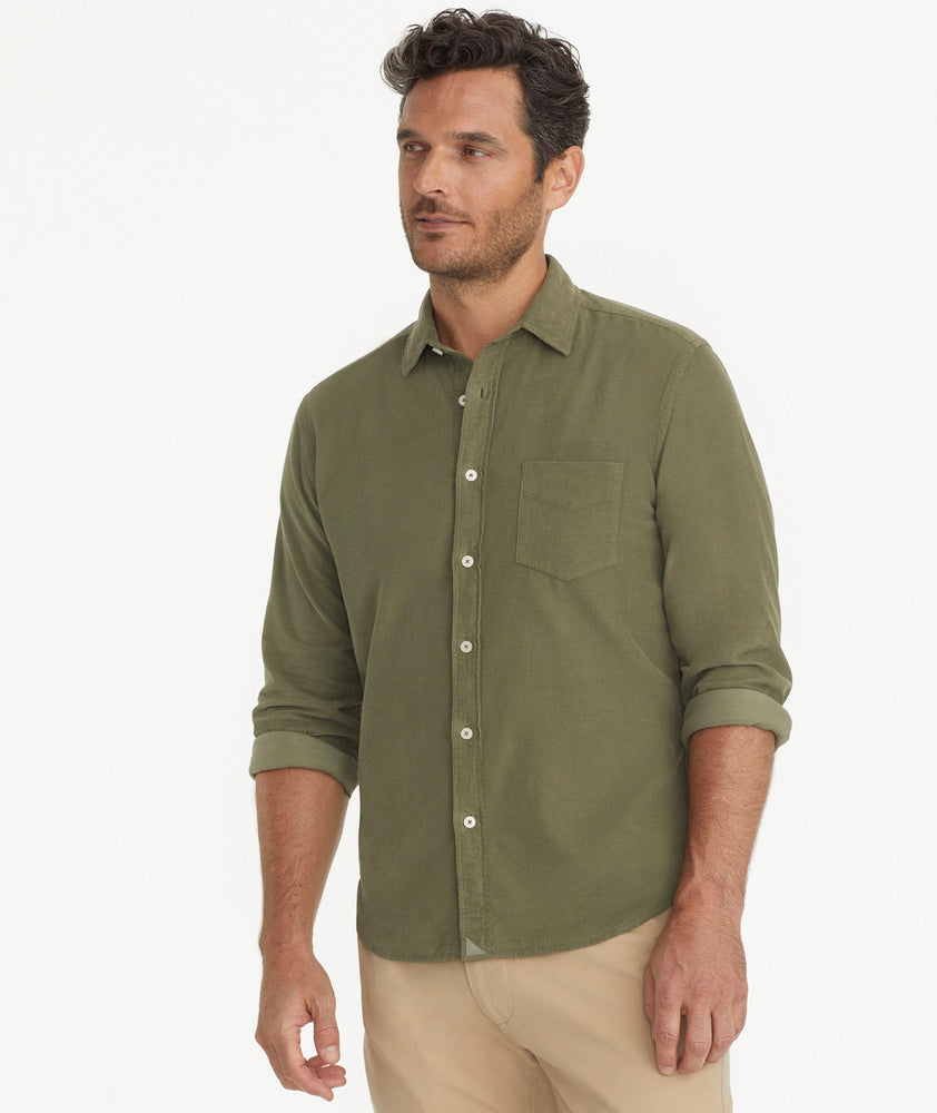 Model is wearing UNTUCKit Caprone Cord Shirt in green.