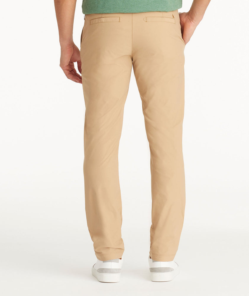 Model wearing UNTUCKit Tan Traveler Pants