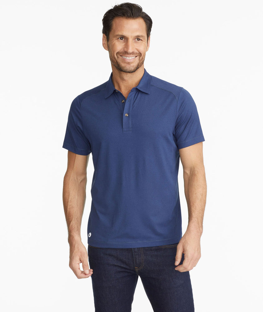 Model wearing a Navy The Performance Polo