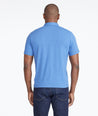Model wearing a Bright Blue The Performance Polo