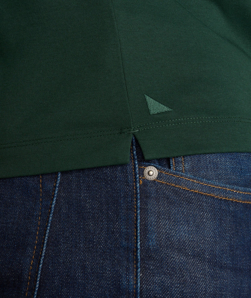 Model wearing a Dark Green Wrinkle-Free Damaschino Long-Sleeve Polo with Contrast Placket