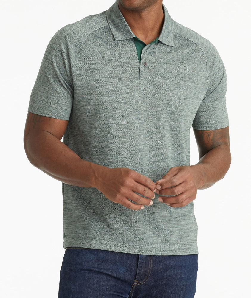 Model wearing an UNTUCKit Dark Green No Sweat Heathered Polo