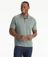 Model wearing an UNTUCKit Dark Green No Sweat Heathered Polo