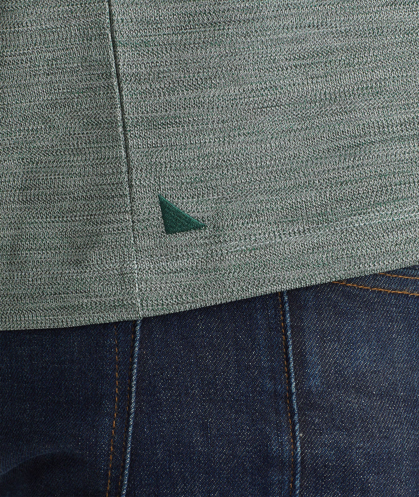 Model wearing an UNTUCKit Dark Green No Sweat Heathered Polo