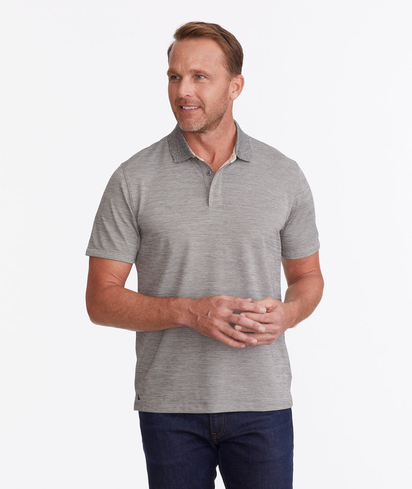 Model wearing a Tan No Sweat Heathered Polo