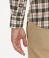 Model is wearing UNTUCKit Wrinkle-Free Harwin Shirt in Olive Multi Plaid.