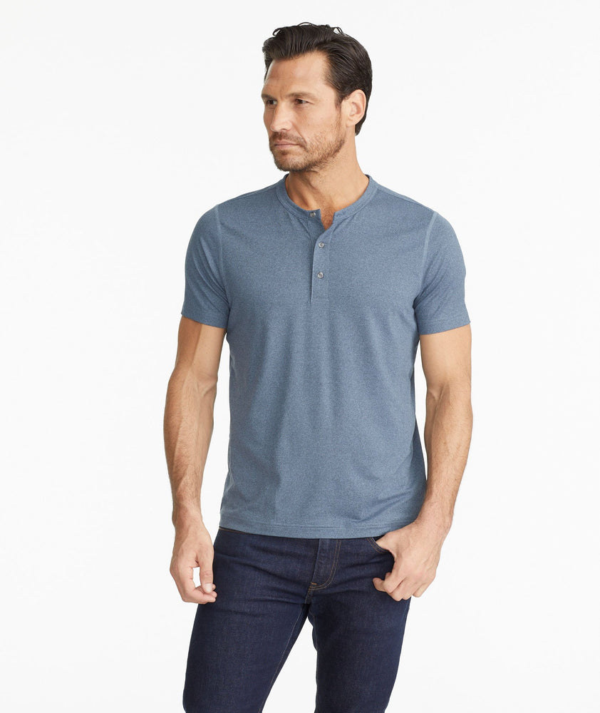 Model wearing a Blue Short-Sleeve Performance Henley