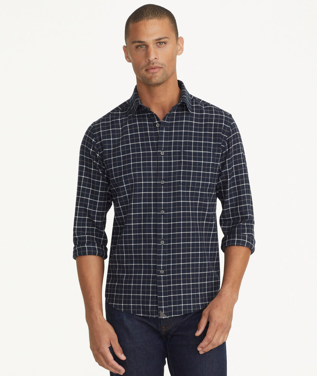 Model is wearing UNTUCKit Flannel Morisco Shirt in Navy & White Windowpane Check