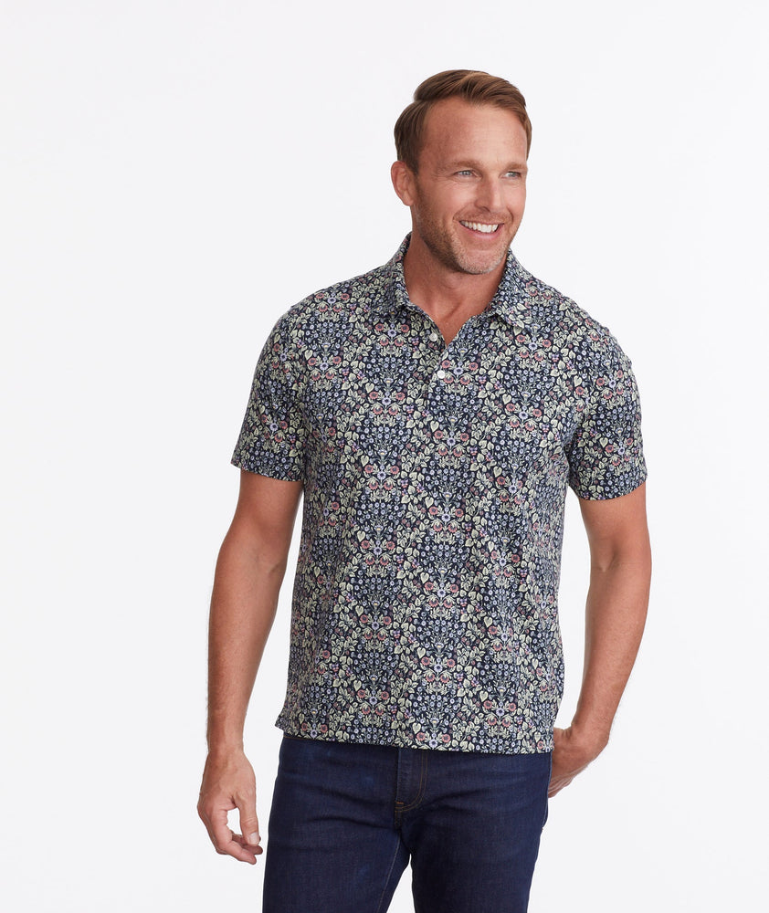 Model wearing a Navy Wrinkle-Free Polo with Floral Print
