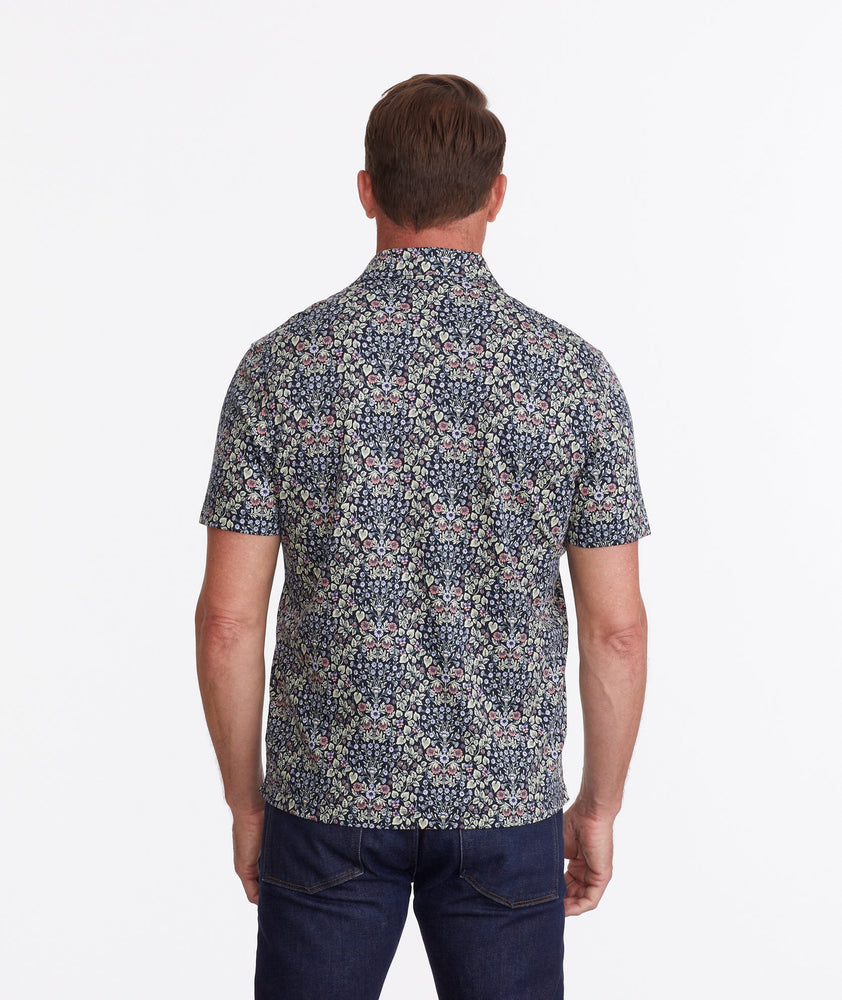 Model wearing a Navy Wrinkle-Free Polo with Floral Print