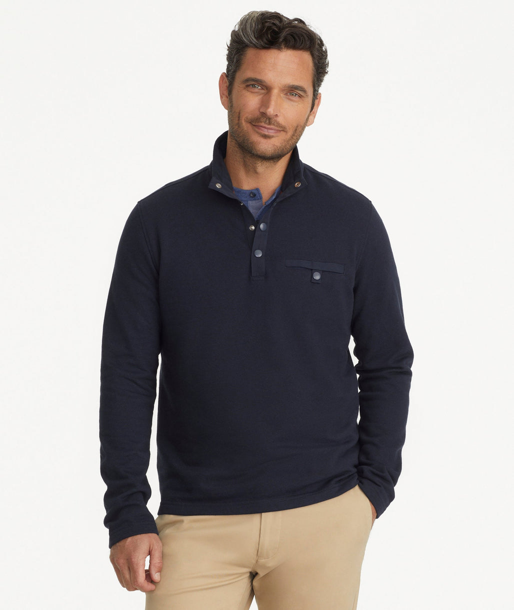 Model is wearing UNTUCKit Parkson quarter-zip sweatshirt in navy.