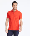 Model wearing a Red Traveler Polo with COOLMAX®