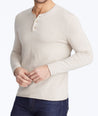 Model wearing a Tan Henley Sweater