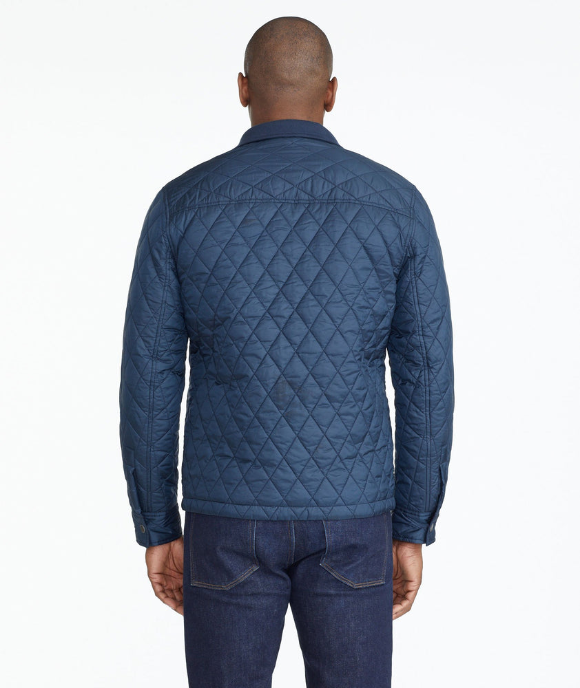 Model wearing a Navy Quilted City Jacket