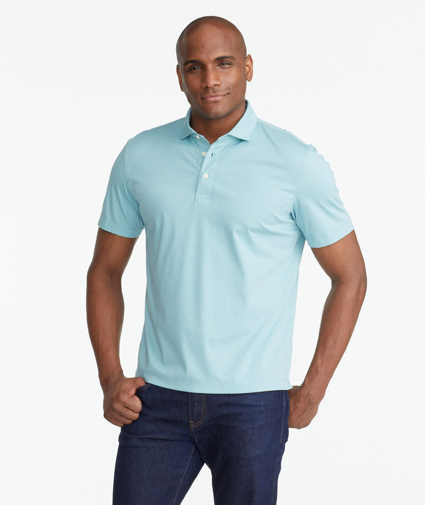 A model wearing a Green Luxe Wrinkle-Free Pique Polo