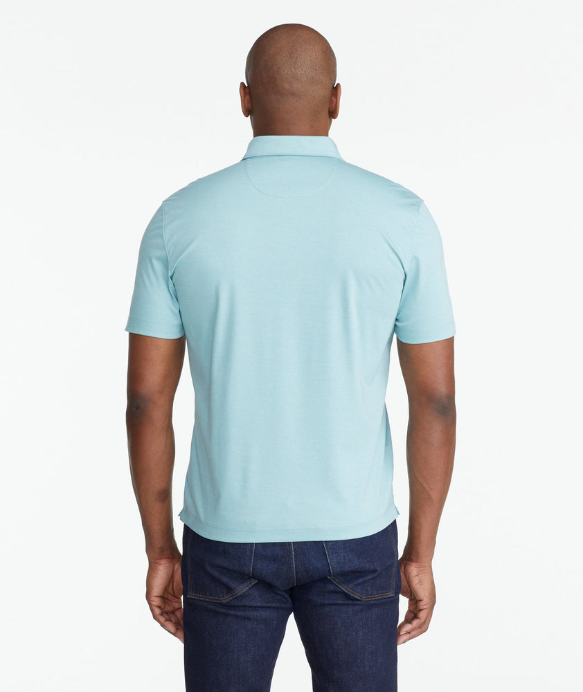 A model wearing a Green Luxe Wrinkle-Free Pique Polo