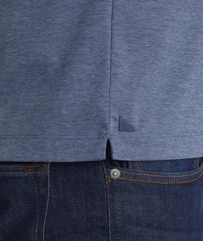 A model wearing a Navy Luxe Wrinkle-Free Pique Polo