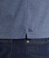 A model wearing a Navy Luxe Wrinkle-Free Pique Polo