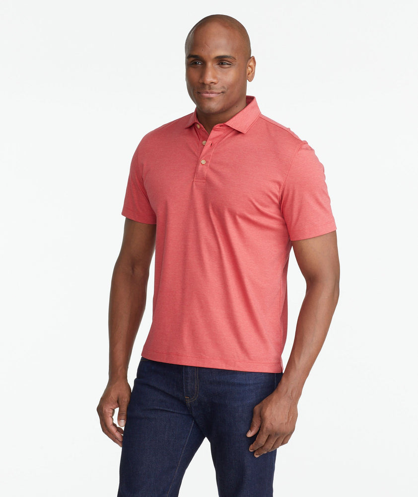 A model wearing a Red Luxe Wrinkle-Free Pique Polo